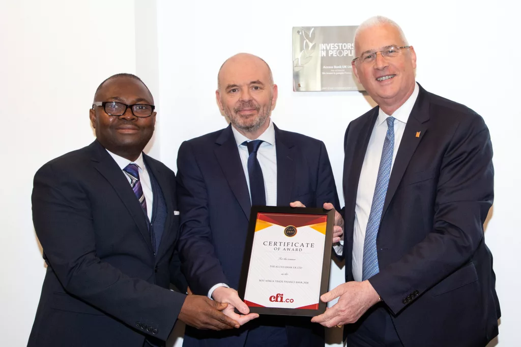 Wasiu Fatai, Head of Trade Finance (left) and Jamie Simmonds, CEO/MD (right) receiving an award from CFI.co