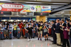 Railway fans and passengers enter Sung Wong Toi Station in Hong Kong on 27 June 2021 to experience MTR’s full Tuen Ma Line service for the first time.