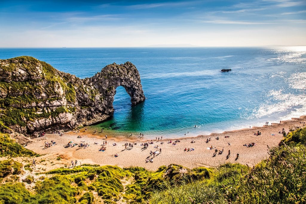 UK: Durdle Door at the beach on the Jurassic Coast of Dorset